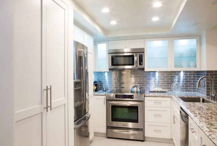 White Shaker Kitchen Remodel with Integrated Laundry Storage — photo 4