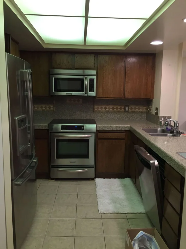 White Shaker Kitchen Remodel with Integrated Laundry Storage — photo 9